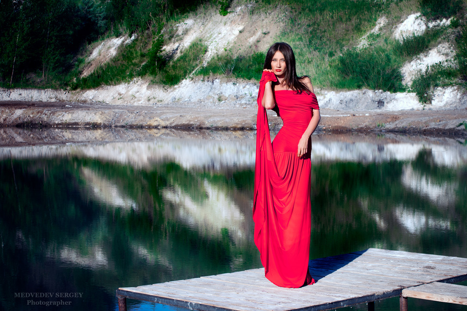 Girl in red gown standing by the lake | lake, reflection, red gown, model